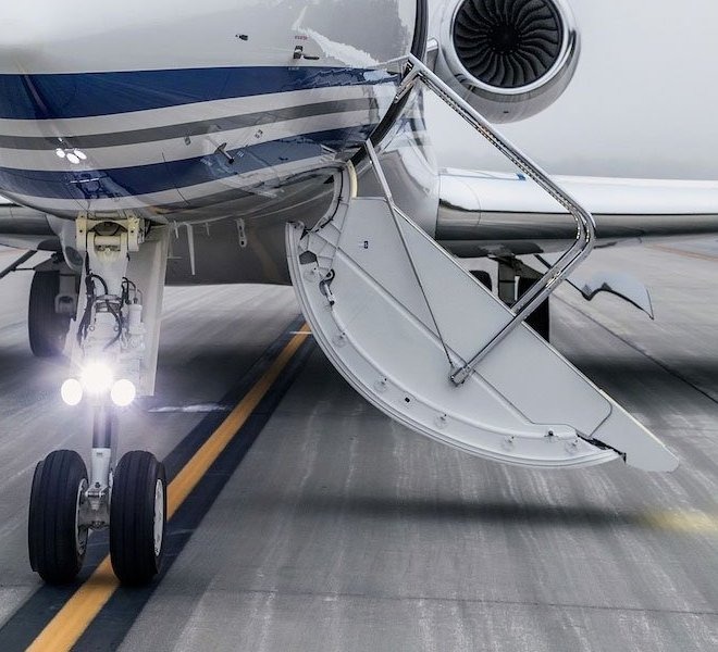exterior of jet on a runway with stairs open